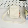 Bolso bandolera pequeño de color liso minimalista japonés con letra bordada, estilo nuevo, estilo casual para exteriores, ligero, con cordón, bolsa para botella de agua