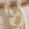 Collar de perlas en capas con cuentas transfronterizo europeo y americano, cadena para la clavícula estilo fiesta vintage, lujo ligero, accesorio versátil de alta gama para mujer