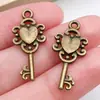 Mezcla 100 retro cinco colores corazón llave trébol de cuatro hojas llave aleación colgante hecho a mano diy accesorios de joyería venta al por mayor