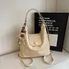 Bolso tote 2026 otoño nuevo modelo mochila de gran capacidad para el trabajo diseño de nicho bolso de hombro para mujer bolso cruzado multiusos