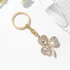 Accesorios de Llavero Colgante para Mujer con Forma de Trébol Completamente Incrustados con Pedrería, Best-Seller Transfronterizo Europeo y Americano