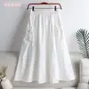 Falda 2023 nueva verano estilo coreano color liso con cordón de amarre bolsillo longitud media talla grande ropa de trabajo falda línea A para mujer