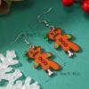 Diseño europeo y americano Navidad doble cara Papá Noel pequeño dinosaurio hueso muñeco animal lindo dulce acrílico pendientes