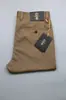 Pantalones casuales de negocios de color sólido de alta gama al por mayor, corte holgado, pierna recta elegante, versátiles, pantalones casuales adelgazantes para hombre en verano