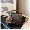 Bolsa de mão de nicho estilo coreano para comércio exterior, nova bolsa Cambridge retrô moderna feminina, bolsa de ombro único transversal com blocos de cor, moderna