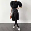 Chic coreano nueva colección de principios de otoño: Falda plisada de piel sintética versátil estilo francés, de cintura alta, longitud media, para mujer
