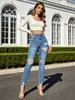 Jeans skinny azules de estilo retro americano, multibolsillos, tiro alto, elasticidad media, dobladillo deshilachado, pantalones ajustados para mujer