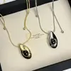Collar con colgante de gota de agua de ágata negra estilo gélido europeo y americano cadena larga de suéter de lujo ligero de nicho alta gama accesorios