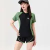 Traje de baño conservador de dos piezas para mujer, manga corta, estilo nuevo, alta gama, adelgazante, que cubre el abdomen, de pierna cuadrada para aguas termales y playa