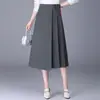 Saia Plissada Irregular de Cor Sólida Feminina 2026 Outono Novo Estilo Fluida Elegante Temperamento Cintura Alta Saia Evasê Tendência