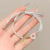 Pulsera de Hilo Rojo de Bebé de Dibujos Animados 2026 Nuevo Estilo Bendición Pequeño Zongzi Pulsera Estilo Chino Festival del Bote del Dragón Hilo de Cinco Colores Ajustable Venta al por Mayor