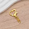 Llavero con forma de corazón y hebilla en forma de ocho, disponible en baño de oro y plata, combinado con un dije en forma de ocho para bolsos y peluches de bricolaje