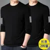 Camiseta elástica de manga larga para hombre, corte holgado, adecuada para primavera y otoño, color liso, versátil, se puede usar como atuendo de pareja, capa interior para hombre