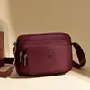 Bolso bandolera retro de moda para mujer, gran capacidad, nuevo de primavera 2026, bolso simple de nailon, bolso de hombro simple y ligero