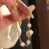 Nuevo brazalete de concha de mariposa blanca y flor, joyería apilable de doble capa con un diseño único, hecho de jade Hetian y trébol de cuatro hojas, perfecto como regalo para un amigo cercano
