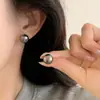 Pendientes de botón de plata S999 con perla verde aurora para mujer 2026 Nuevo estilo popular Verde pavo real Alto nivel Lujo ligero Sensación noble