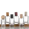 Frasco de Perfume High-End de 50ml em Estoque, Frasco Cilíndrico de Vidro com Fundo Espesso, Boca de Rosca Torcida à Mão, Frasco de Enchimento tipo Baioneta, Tampa Esférica, Tampa de Madeira