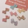 Parche de resina con forma de lazo asimétrico con puntos y ondas de colores que caen al óleo para mujer, accesorio para hacer joyas, material para carcasa de teléfono móvil