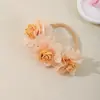 Novos acessórios de cabelo transfronteiriços europeus e americanos para bebês, elásticos de cabelo macios e elásticos que não apertam os cabelos, adereços de cabeça de chiffon com múltiplas flores para crianças
