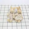 Juguete de peluche pareja conejo de lino muñeca tela de flores articulado Conejo bolsa colgante joyería diy muñeca decorativa conejo