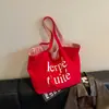 Bolsa de Lona Grande de un Solo Hombro Rayada Bordada con Letras Transfronteriza Estilo Coreano de Nicho para Viaje Primavera/Verano 2026