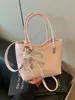 2026 nuevo bolso tejido de nicho de alta gama, bolso tipo cubo, bolso tipo dumpling, bolso simple y elegante de alta gama para llevar debajo del brazo para mujer
