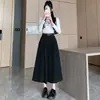 Foto real de falda midi de algodón lavado estilo europeo para mujer de otoño, de cintura alta, con bajo amplio, adecuada para tipo de cuerpo pera, con un efecto de caída que disimula las caderas