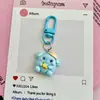 Lindo Llavero de Animales Abrazando Frutas Bola de Dibujos Animados Sanrio Corazón Femenino Colgante para Bolso Adorno Pequeño Regalo