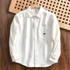2025 Camisa casual de manga larga suelta de color liso para hombre, estilo americano, cepillada, retro japonés, comercio exterior, nueva, al por mayor