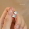 Brincos de Tarraxa Estilo Coreano Prata de Lei S999 Pedra Olho de Gato Branco para Mulheres 2025 Nova Moda Nicho Estilo Cool Simples para o Dia a Dia