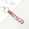 6053 # Acessório de Chaveiro de Cordão de Couro Macio Colorido com Escrita Feliz, Pingente de Corrente de Quatro Seções Feito à Mão, Presente de Formatura