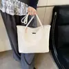 Bolso nuevo popular de este año para mujer 2025 verano estudiantes gran capacidad estilo extranjero combina con todo bolso de axila bolso de hombro tipo cubo