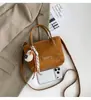 Moda de textura transfronteriza nicho bolso cubo bolso de mujer 2026 nuevo otoño retro simple bolso de hombro bolso cruzado moderno