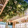 Ramas de flor de cerezo flor de durazno falsa plantas verdes de techo decoración enredaderas de flores de interior pared de celebridad de internet supermercado restaurante habitación cubierta superior fealdad