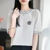 Nuevo Top Camiseta de Punto de Piña de Seda de Hielo Primavera/Verano 2026 Cuello Redondo Manga Corta Broche de Camelia Bloque de Color