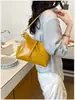 Bolso de mano de moda para mujer, nuevo modelo de otoño 2026, de alta gama, casual, para el trabajo, al hombro, cruzado, tipo cubo, para debajo del brazo