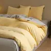 Juego de cuatro piezas de algodón puro cepillado de lujo ligero para otoño e invierno, juego de ropa de cama de tres piezas de color liso bicolor de algodón cálido y grueso