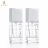 En stock Botella cuadrada irregular de 30 ml para base de maquillaje con cabezal de bomba transparente, botella de vidrio para dispensar loción, venta al por mayor