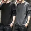 Camiseta casual masculina versátil de cor sólida para o outono 2026, gola redonda solta, manga longa, top moderno