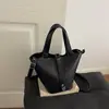 Bolso tipo cubo texturizado estilo western 2026 versión coreana verano nueva moda simple casual versátil bolso de hombro cruzado
