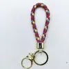 Venta al por mayor del fabricante Llavero de Cuerda de Aleación Tejida y Cuero Accesorios Colgantes Material PU Bolsas Pequeñas de Regalo Accesorios para Llaveros