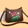 Bolsa de ombro bordada para mulheres, nova tendência de moda 2026, bolsa de mamãe com um estilo chinês de alta qualidade, bolsa de mão e bolsa transversal