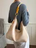 Bolso cruzado casual simple de color liso de gamuza de alta gama 2026 nuevo otoño con textura moda bandolera para mujer