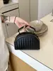 Bolso tejido de lujo ligero de estilo coreano de nicho para mujer, bolso casual tipo concha para el verano 2026, bolso de hombro y cruzado de alta gama