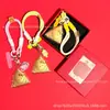 Llavero de recuerdo del Festival del Bote del Dragón de oro puro 999, colgante de cadena para teléfono de gato KT de dibujos animados creativos zongzi, venta al por mayor personalizada