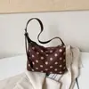 Bolso de gran capacidad para mujer, nuevo y popular bolso de hombro y axila de lunares 2026, bolso de mano pequeño elegante y único