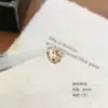 Pendientes de Cobre Ecológicos en Color Café Dorado Claro, Aros Versátiles de Flor de Iris, Modernos Clips para Oreja de Perforación Cruzada