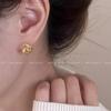 Pendientes de metal elegantes y únicos con diseño de hebilla de oreja con giro dorado, estilo moderno 2024, para mujer