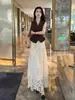 Traje Elegante de Alta Gama Estilo Coreano para Mujer Verano 2026 Top sin Mangas de Cuello en V y Falda de Encaje Calado Conjunto de Dos Piezas