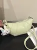 Bolso de Diseño de Nicho Minimalista de Color Sólido con Forma de Cuerno para Mujer 2026 Nuevo Versátil de Moda para Viaje Diario Bolso de Hombro Cruzado
